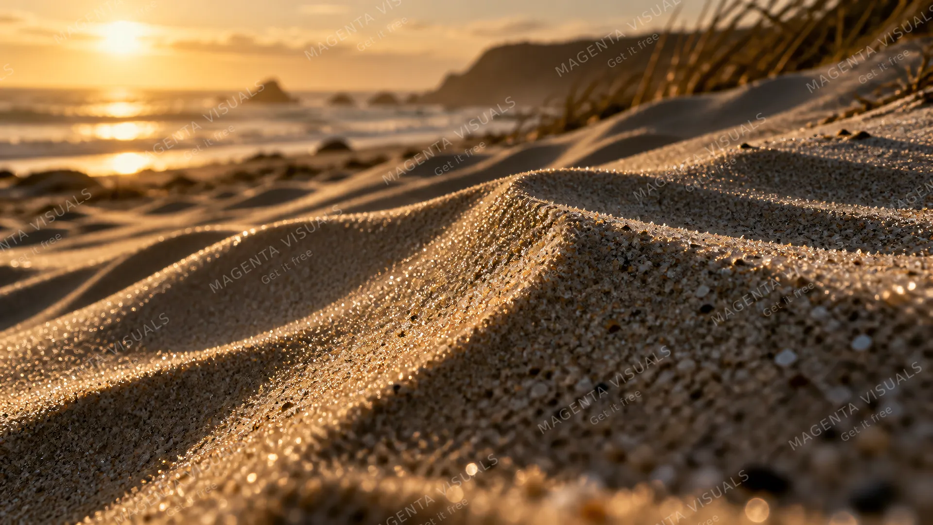 4K 16:9 widescreen cinematic photograph shot on RED Digital Cinema Camera featuring an extreme close-up macro texture of wind-sculpted coastal dunes at late afternoon raking side lig…