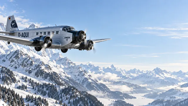 4K wallpaper of 16:9 widescreen Windows desktop wallpaper of a 1930s Alpine transit through snowy mountain passes in crisp frosty morning light.