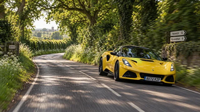 4K wallpaper of A 16:9 widescreen desktop wallpaper featuring an empty country lane vanishing through lush green hedgerows and dappled afternoon sunlight filling the calm left half as negative sp…