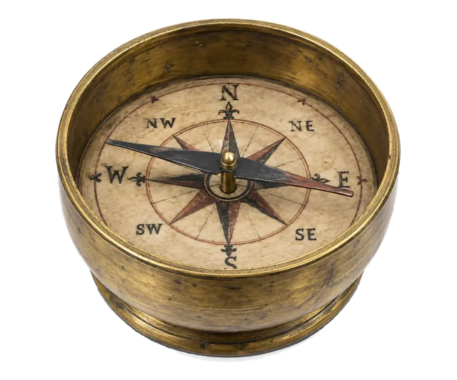 4K transparent cutout of product photography of a single 13th century medieval European dry compass with a magnetized needle pivoting on a pin above a compass card inside a round brass bowl, isolated obje…