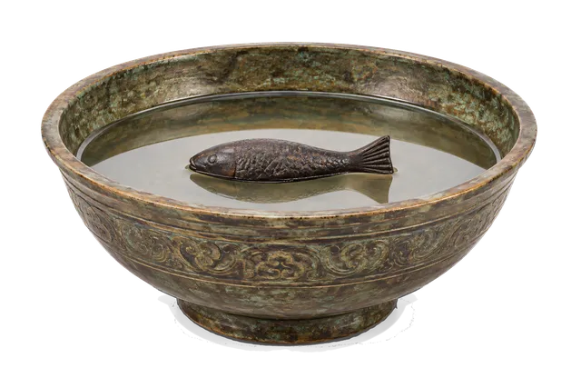 4K transparent cutout of product photography of a single ancient Chinese south-pointing fish compass consisting of a magnetized iron fish floating in a shallow bowl of water, isolated object, entire subje…