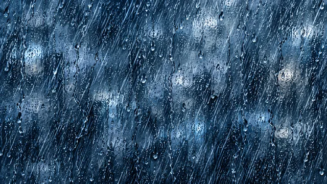4K 16:9 widescreen desktop wallpaper featuring a full-bleed pattern of intense rain streaks against wet glass.