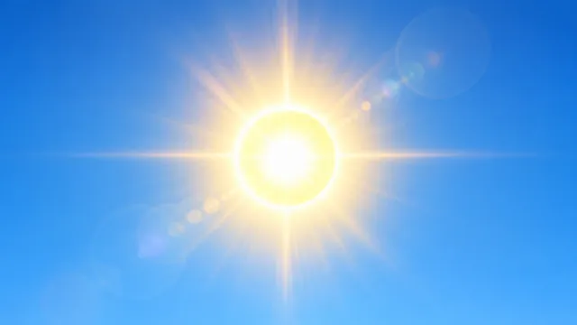 4K 16:9 widescreen desktop wallpaper of a bright, glowing disc of the sun centered directly in the middle of a vast, clear blue sky.