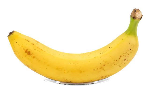 4K transparent cutout of product photography of a single yellow banana, curved shape, smooth peel with subtle brown spots and a green stem, isolated object, entire subject visible, centered in frame, pure…
